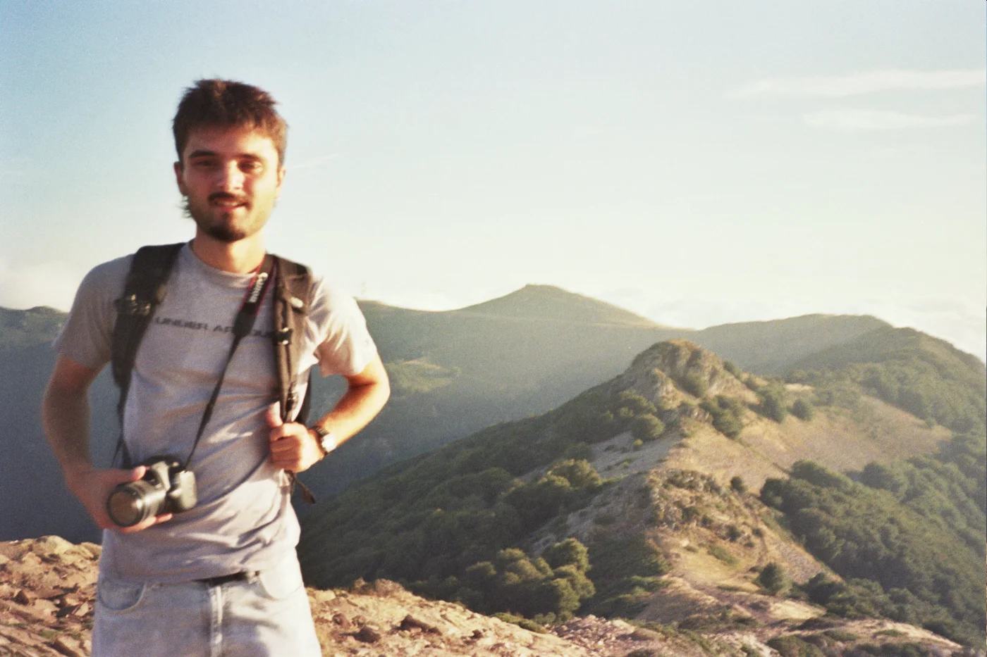 Eric with a camera on a mountain