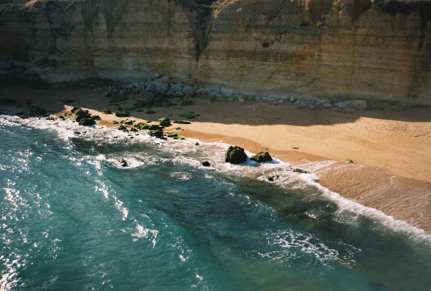 Aerial view of a turquoise-water beach